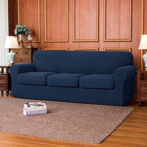 The slipcover draped over a navy-colored couch