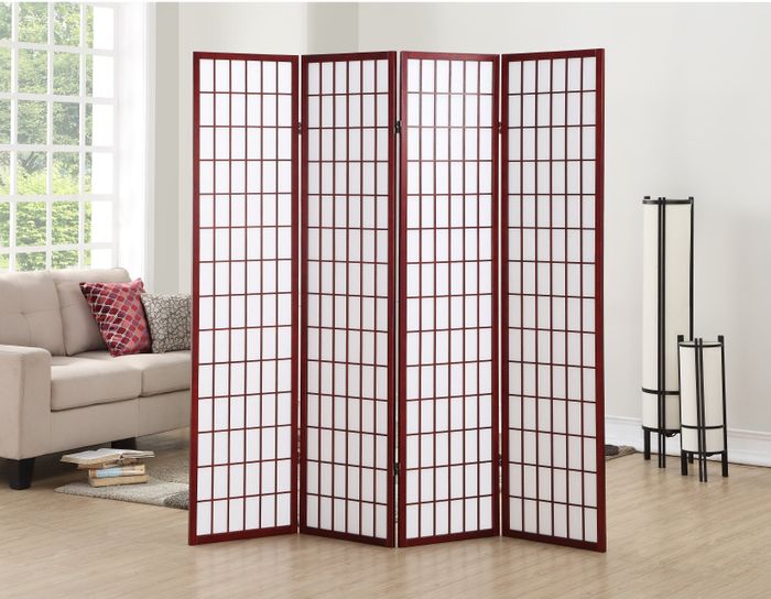 A four-panel wooden screen in cherry, standing proudly in a cozy living room.