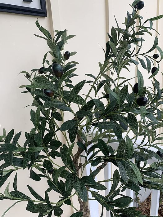 a close-up view of the olive tree branches, complete with fake olives