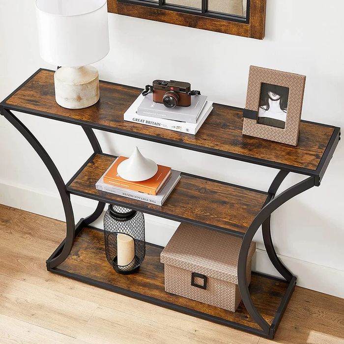 The console table rests against a wall, adorned with various trinkets.