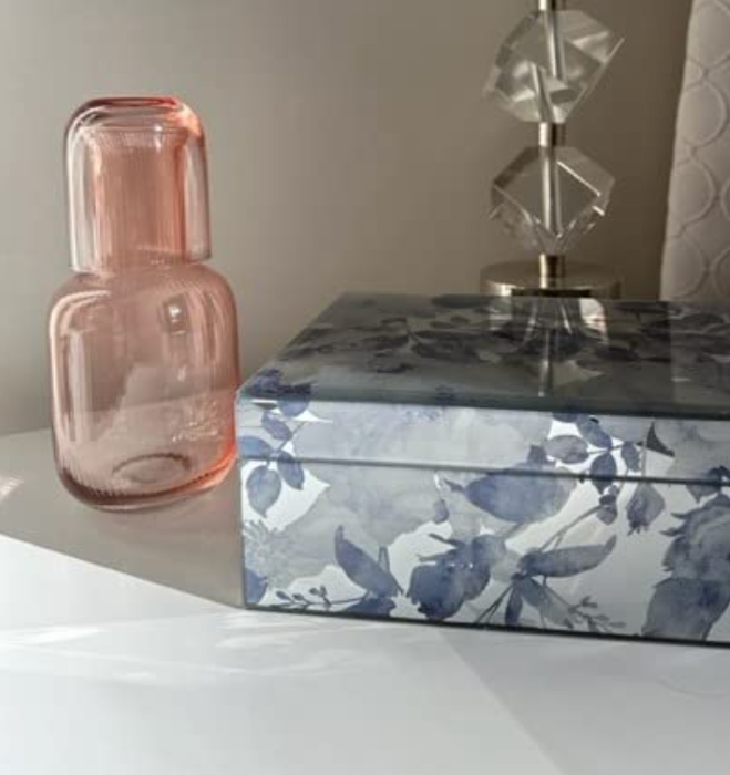 same set with the tumbler resting on top of the carafe as a lid