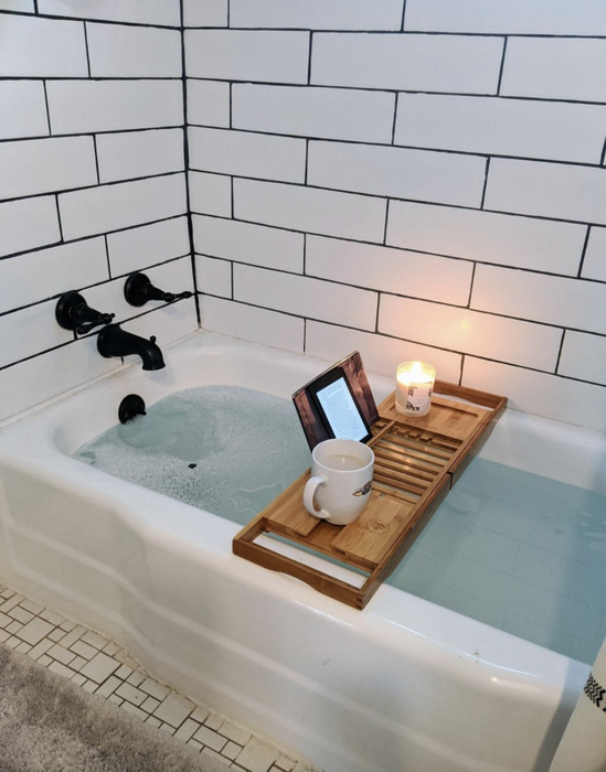 reviewer photo of the tray featuring a Kindle and a mug of coffee