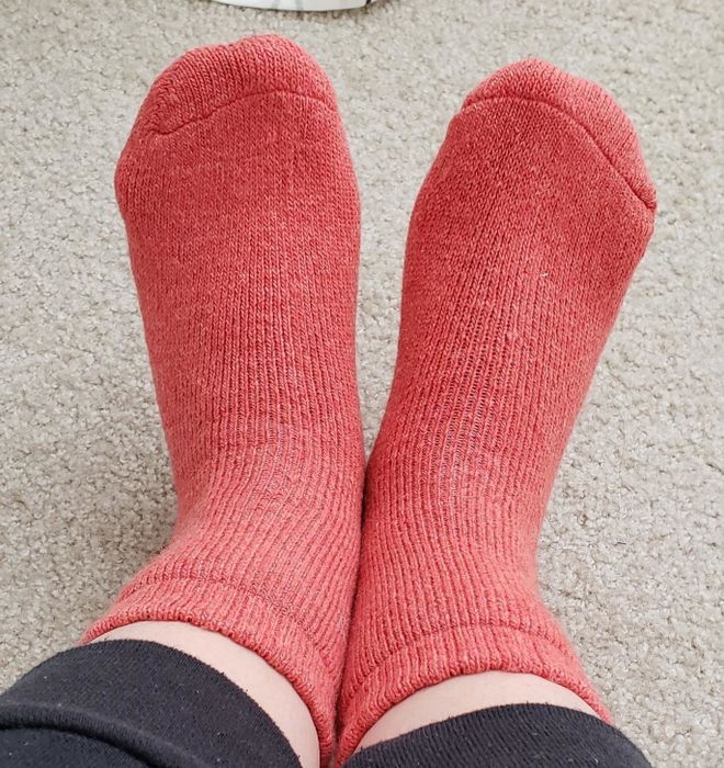 reviewer wearing the red socks