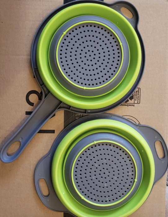 the two gray and green strainer and colander
