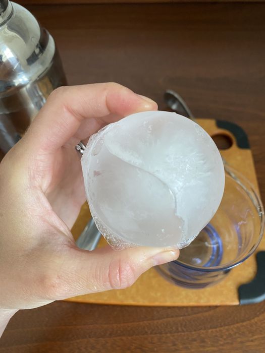 Mytour writer Hannah Loewentheil holding a large, round ice cube