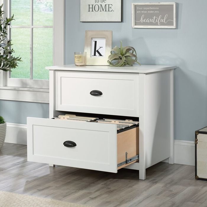 A soft white cabinet designed to hold your files neatly, blending seamlessly into a home environment.