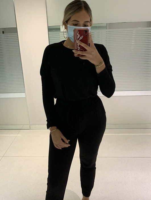 reviewer showcasing the set in black