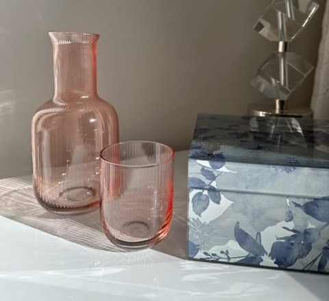reviewer's blush pink carafe and tumbler set on display