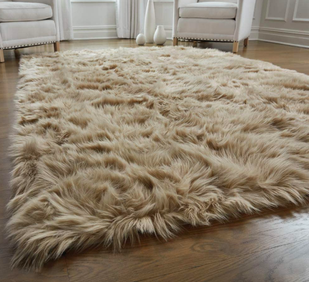 Fluffy rug placed on a wooden floor