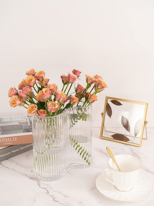 A clear vase holding fresh flowers
