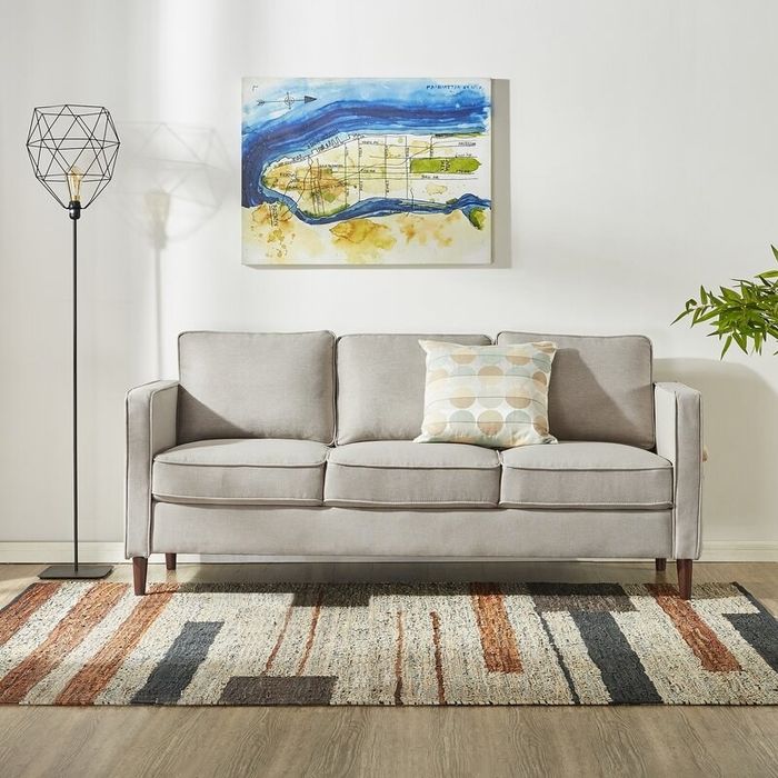 The square arm sofa in a soft beige tone