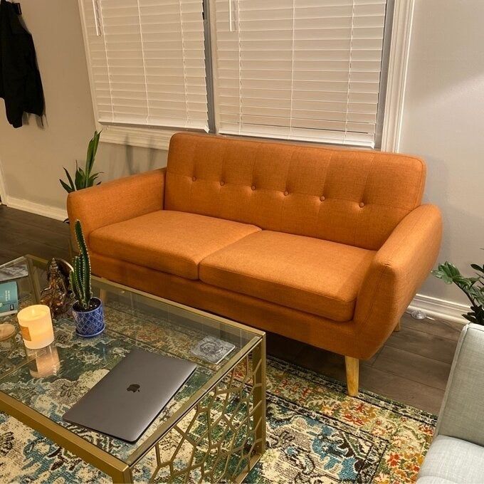 The loveseat in a bold orange hue