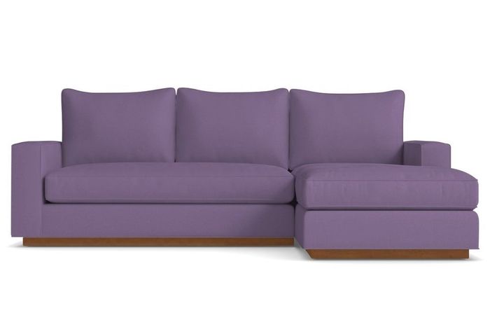 A stylish purple couch that adds a bold pop of color to any room.