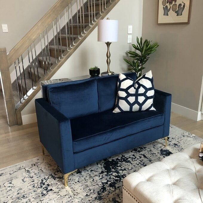 A reviewer’s photo of the couch in blue
