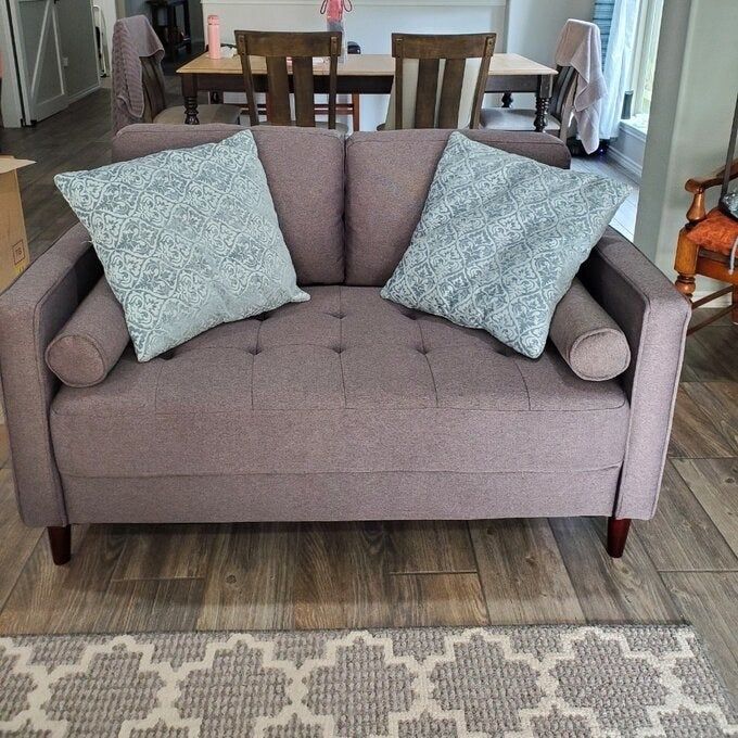 A photo showcasing the couch in a sleek gray tone