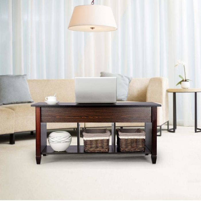 A wooden coffee table placed in the living room.