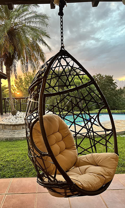 A reviewer's photo of the hanging chair placed outdoors.