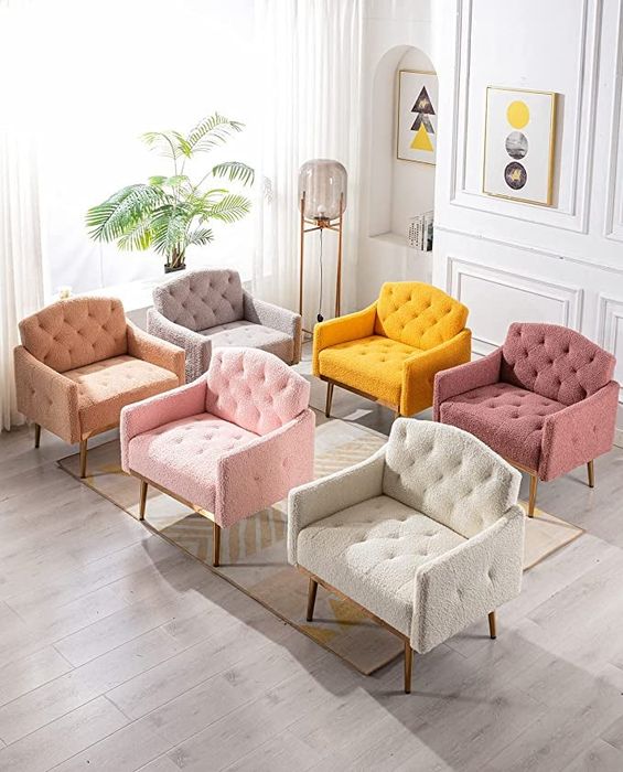 A set of six tufted and upholstered chairs in hues of pink, white, tan, grey, and yellow.