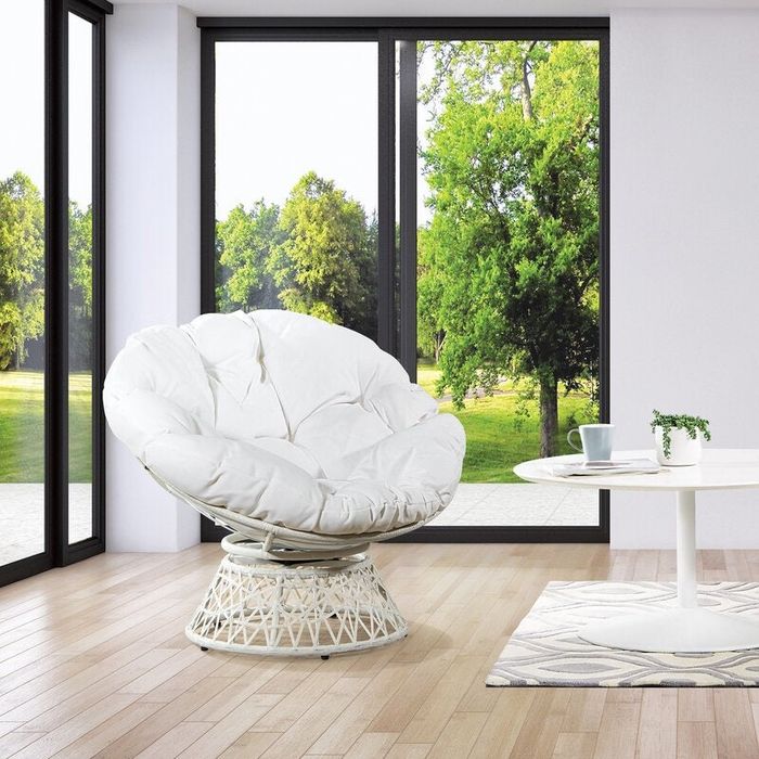 An image of a white chair with a white cushion.