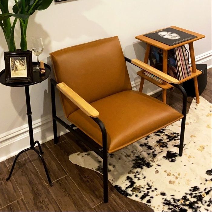 A faux-leather chair situated in a reviewer’s home environment.