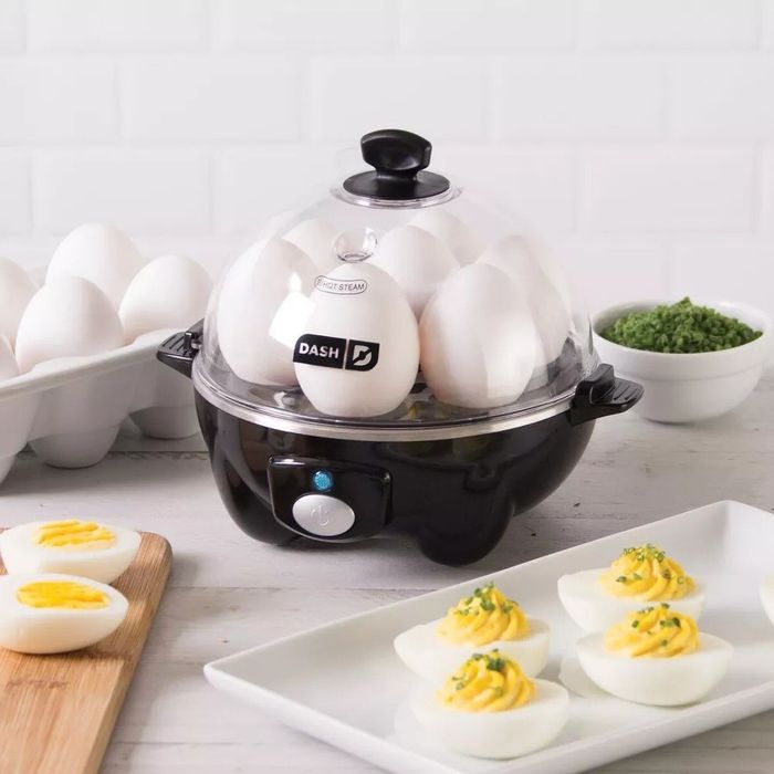The black egg cooker preparing seven eggs simultaneously
