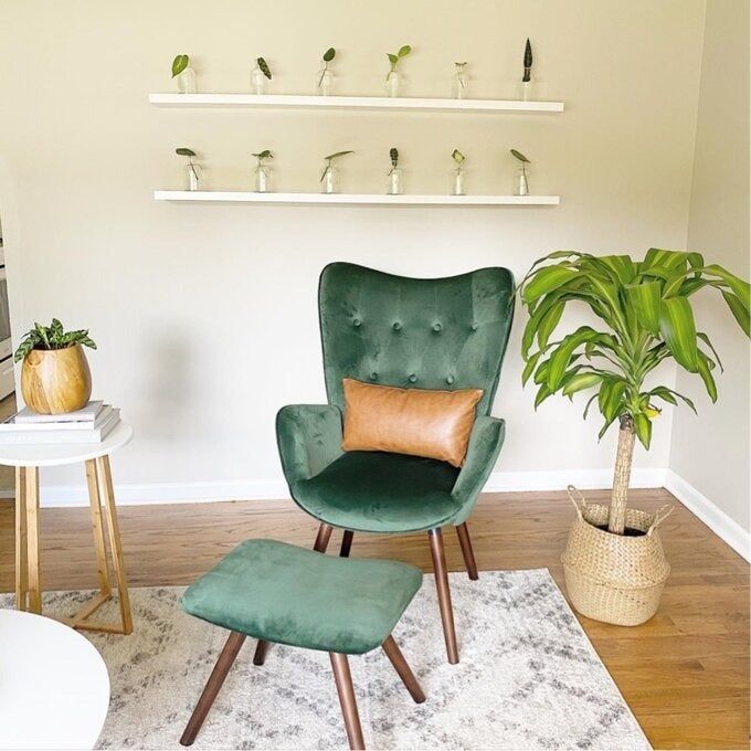 A photo of the green armchair with matching ottoman, as reviewed by a customer