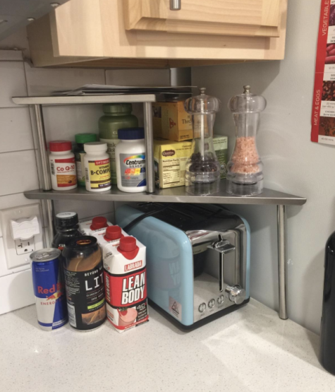 A photo from a reviewer showing the shelf in their kitchen, with a toaster placed underneath it.