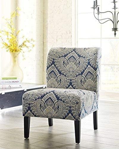 An armless chair adorned with a blue medallion pattern.