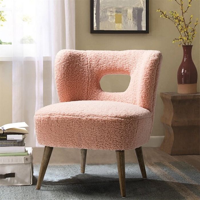A soft, pink plush cutout chair, designed for ultimate comfort and a stylish addition to any room.