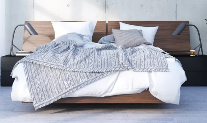 Lifestyle photo of a wooden floating bed