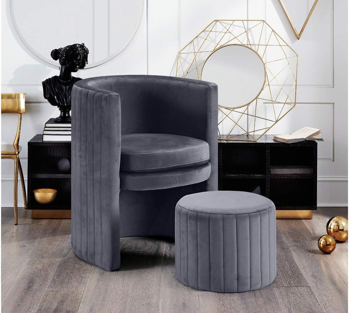 The gray chair paired with a matching ottoman, adding comfort and style to the room.