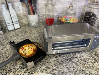 The same toaster flipped over to function as a toaster oven.