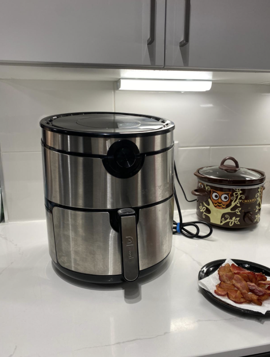 The air fryer placed on the countertop, ready for cooking.