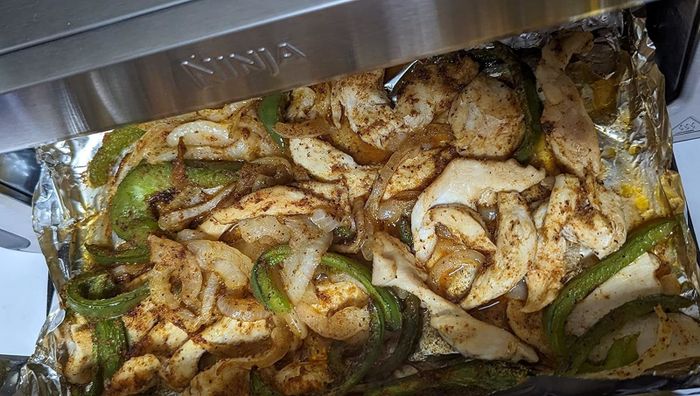 Seasoned chicken and vegetables cooked to perfection in a Ninja air fryer