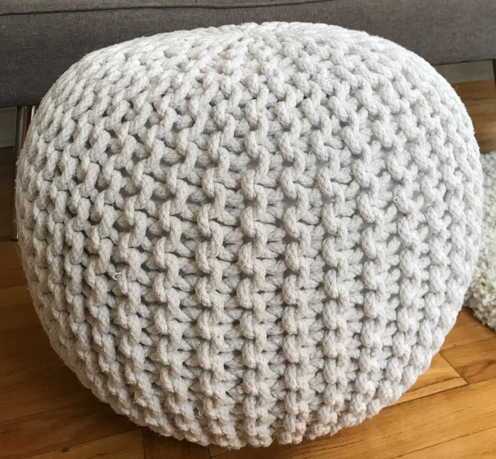 A photo of an ivory ottoman shared by a reviewer.
