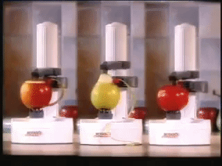 The electric potato peeler working on potatoes, kiwis, oranges, and pears.