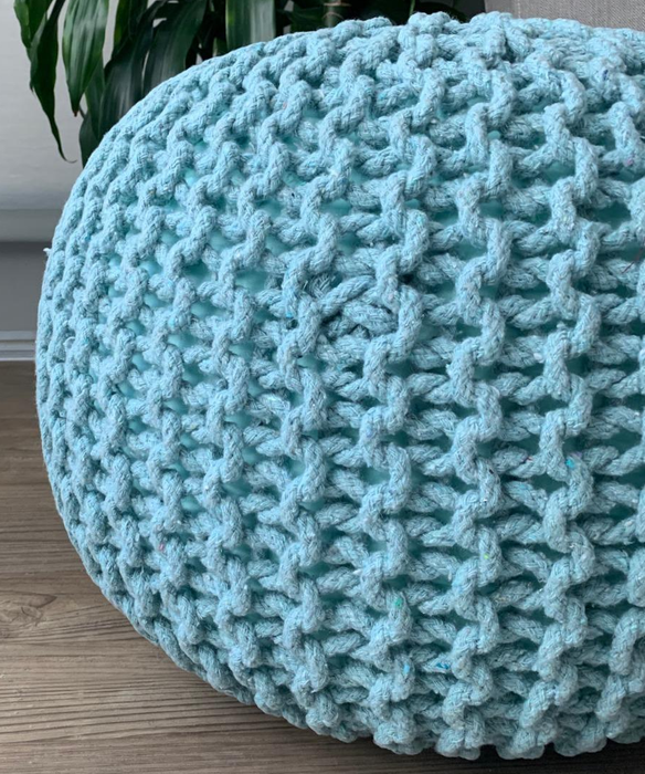 A photo of a blue ottoman shared by a reviewer.