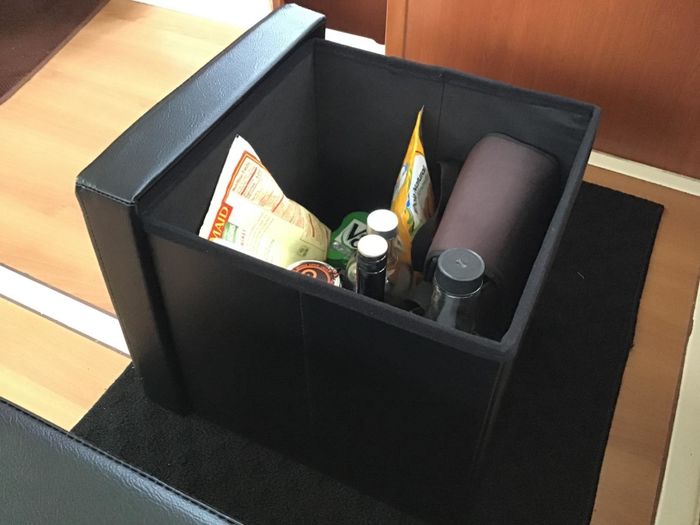 A photo showing snacks inside one of those ottomans.
