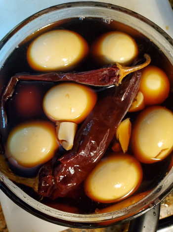 reviewer's image of hard-boiled eggs soaking in marinade