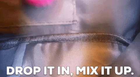 a gif showing the ball being dropped into a purse and shaken around