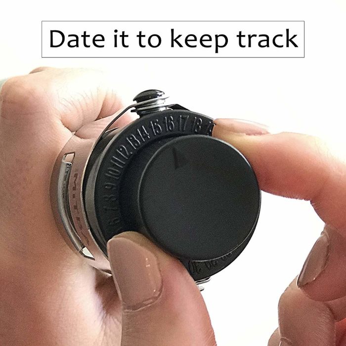 A model adjusting the dial on the stopper with text displayed
