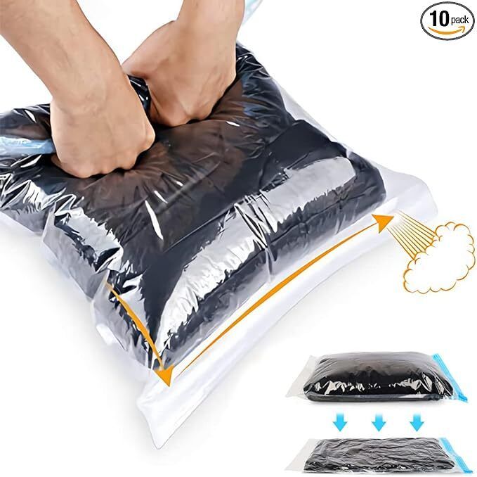 Hands pressing a vacuum-sealed bag to shrink its size for easier storage