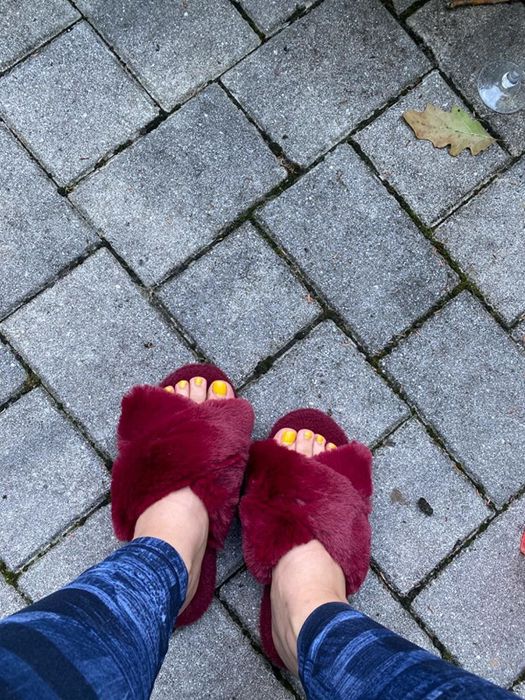 A different reviewer sporting burgundy slippers