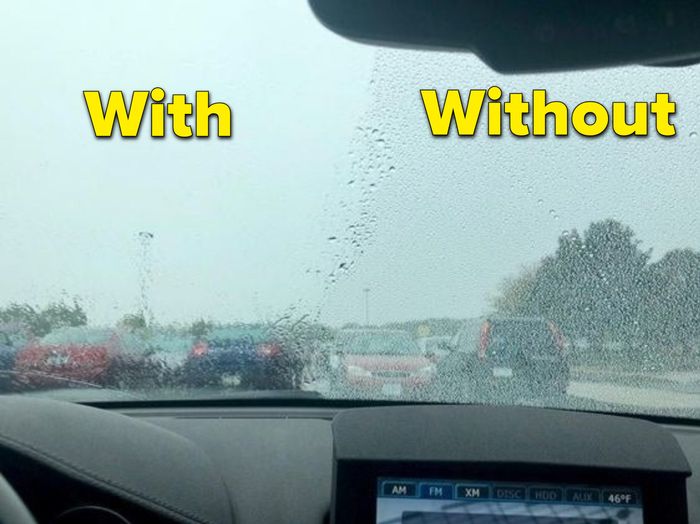 A customer review photo showing their car's windshield, one side is clear, and the other untreated side is covered in raindrops