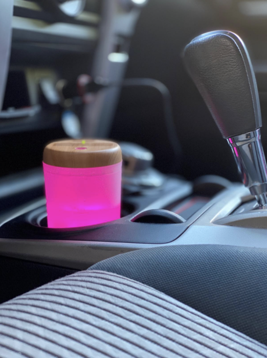 Humidifier glowing pink inside the car