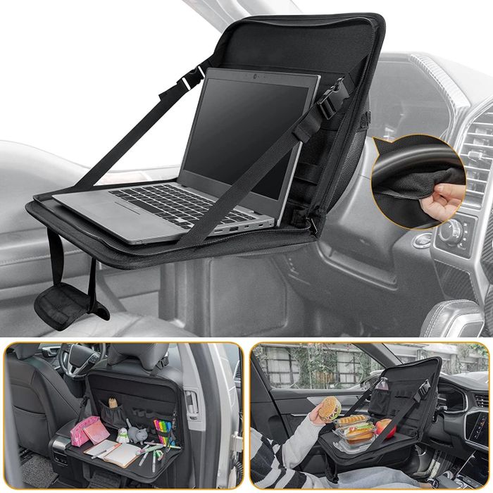 The desk in use for writing, eating, and using a laptop while sitting in a car