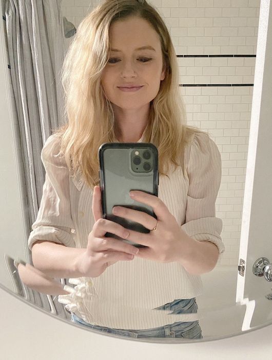 A mirror selfie showcasing Britt's hair with highlights.