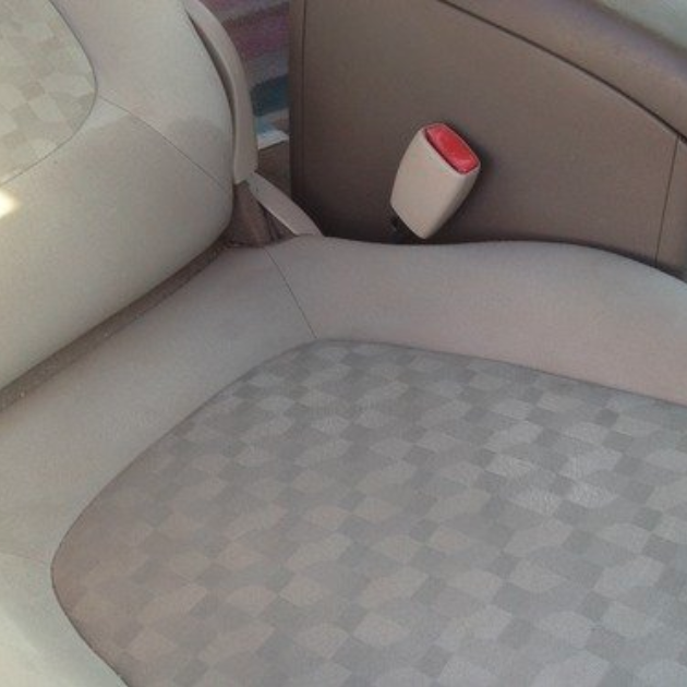 A reviewer photo showing the same seat, now free of stains, after using the spot remover