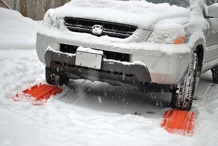 Orange plastic tracks placed beneath the two front wheels
