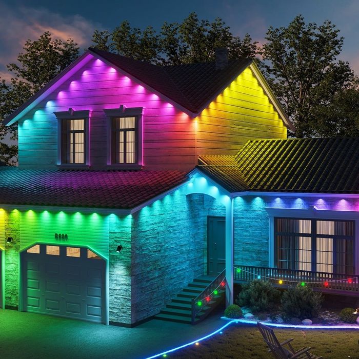 A home adorned with vibrant, colorful lighting creates a festive atmosphere.